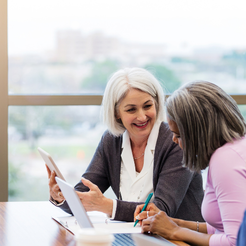 women having a discussion at work