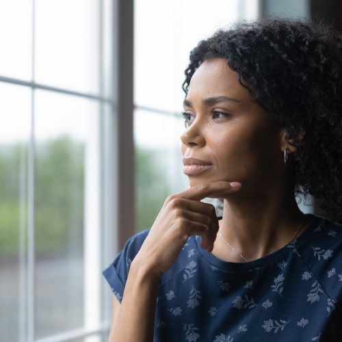 woman thinking at window