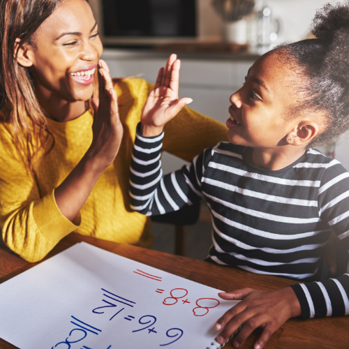 Mother high fiving her daughter