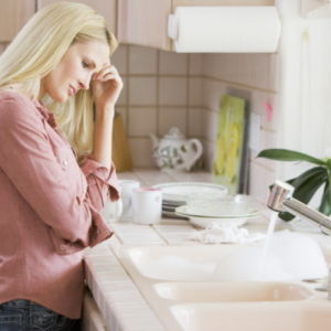 woman standing at sink