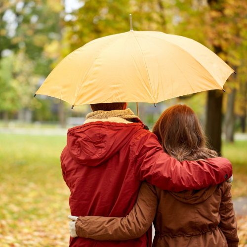 couple walking with umbrella