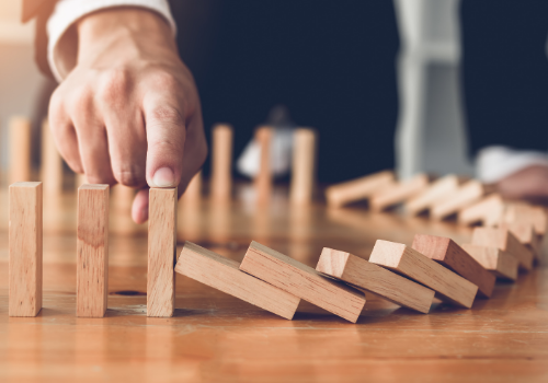 man holding block from falling