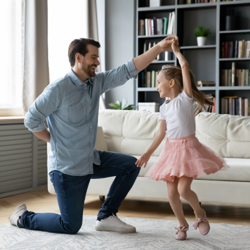 Man dancing with daughter