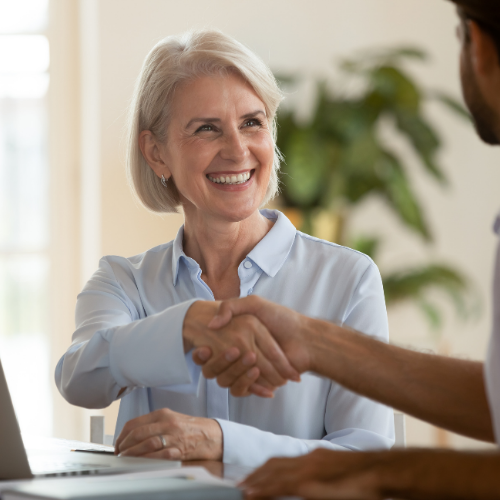 woman shaking hand smiling