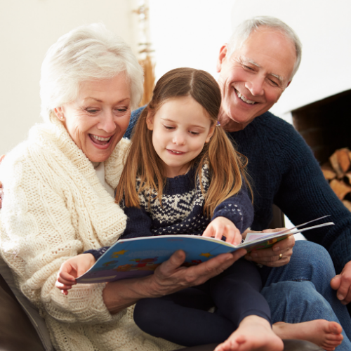 Grandparents reading to grandchild Grandparents reading to grandchild